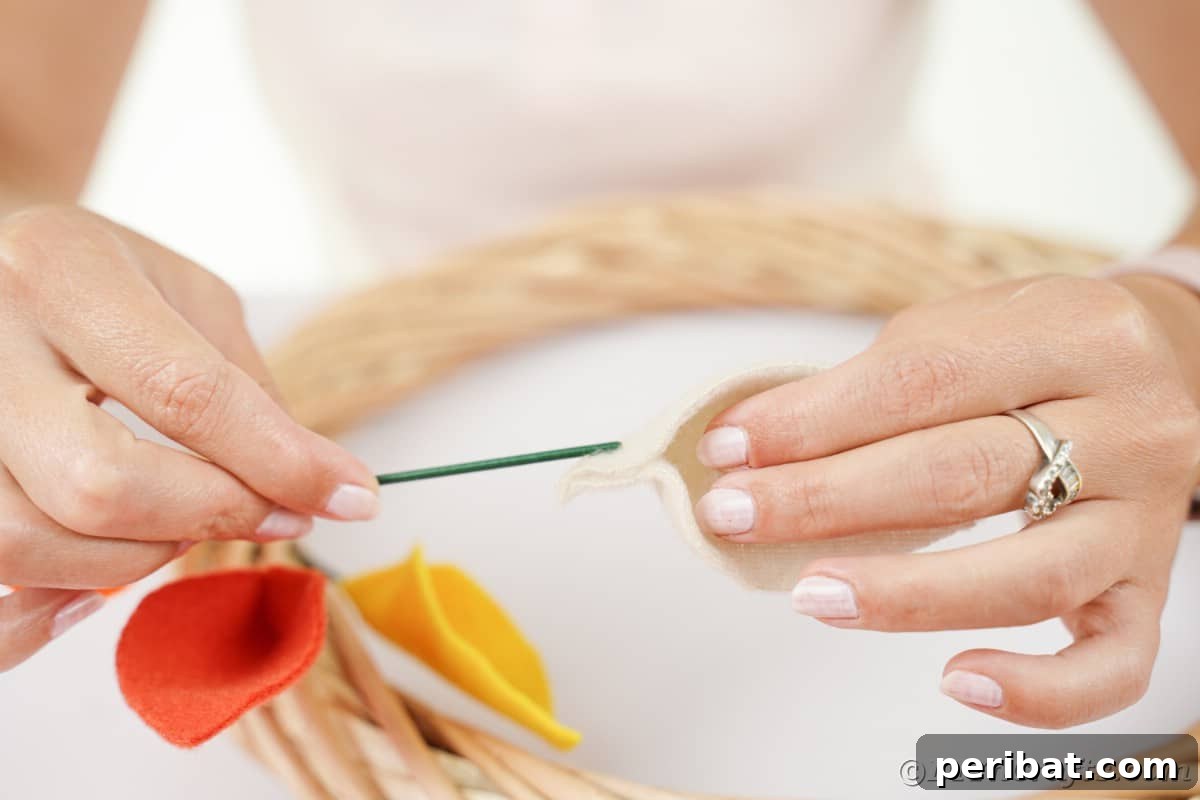 Adding floral wire to leaf