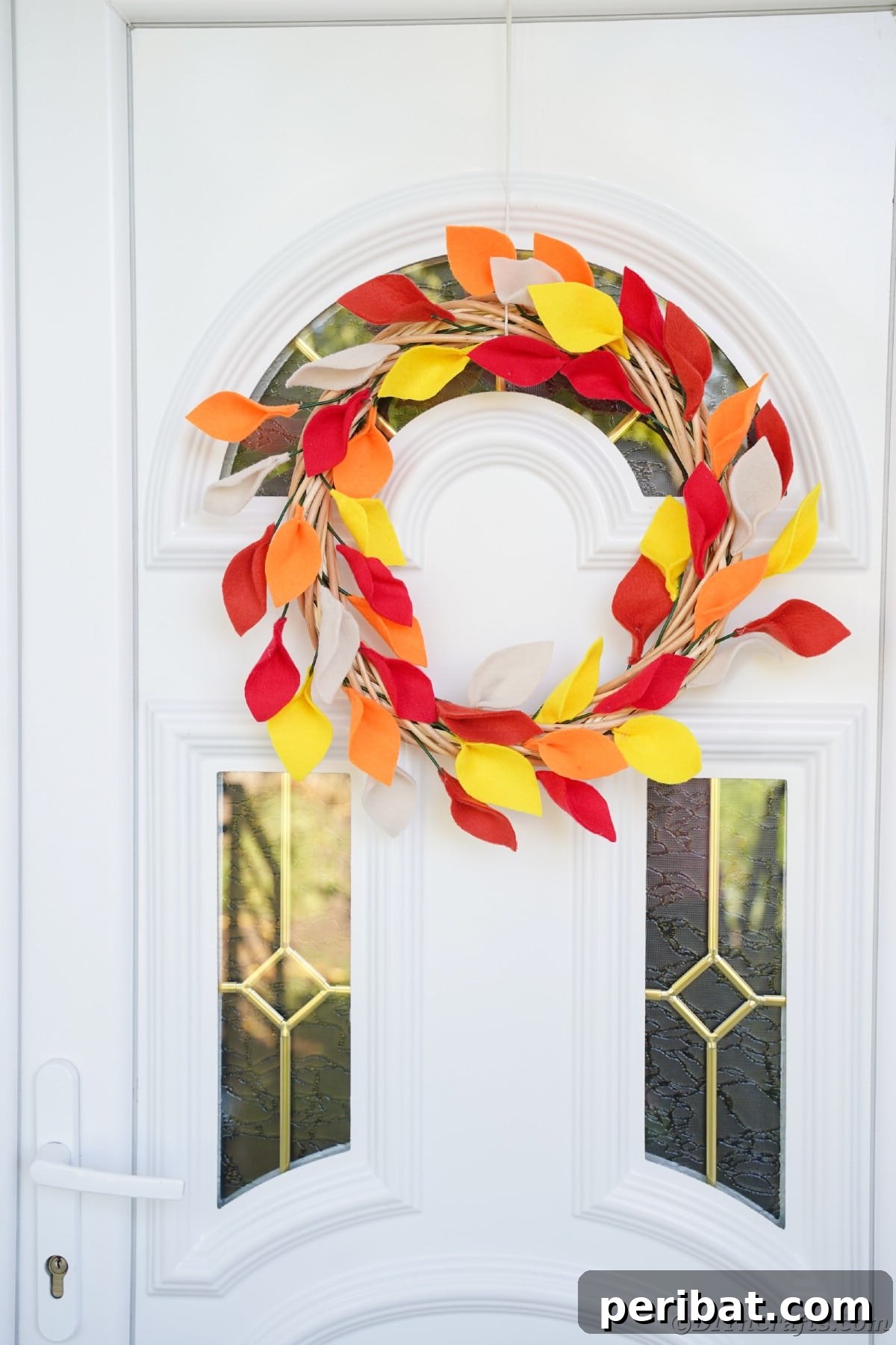 Fall wreath hanging on white door
