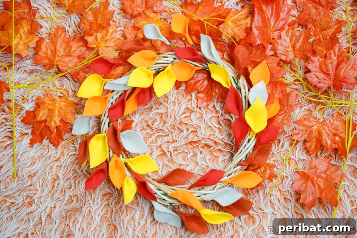 Fall leaf wreath on orange rug 