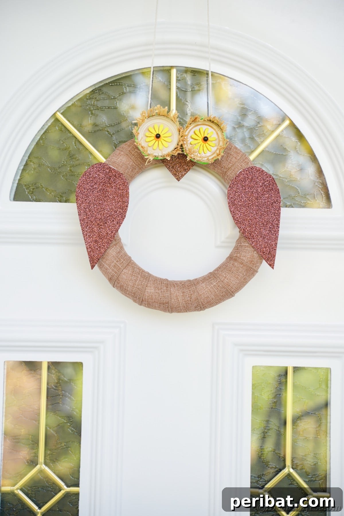Farmhouse Burlap Owl Wreath 24 Hanging owl wreath on white front door with glass panels, highlighting the overall exterior appeal of the craft