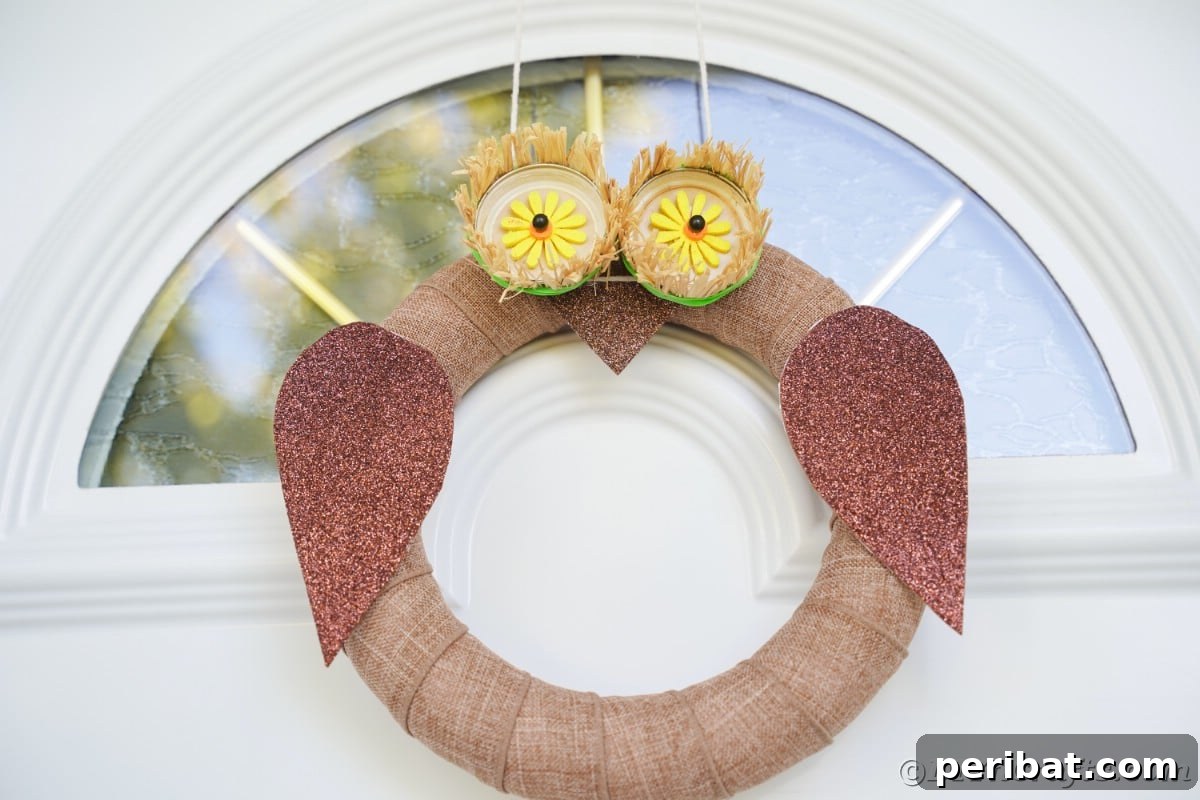Farmhouse Burlap Owl Wreath 5 Rustic owl wreath on door, demonstrating how to hang and display your finished DIY craft