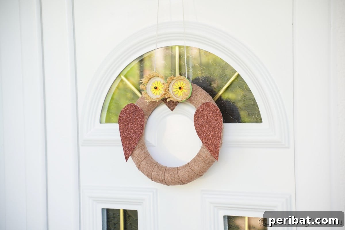 Farmhouse Burlap Owl Wreath 7 Burlap wreath looks like an owl on white door, showcasing the simple elegance of the rustic design