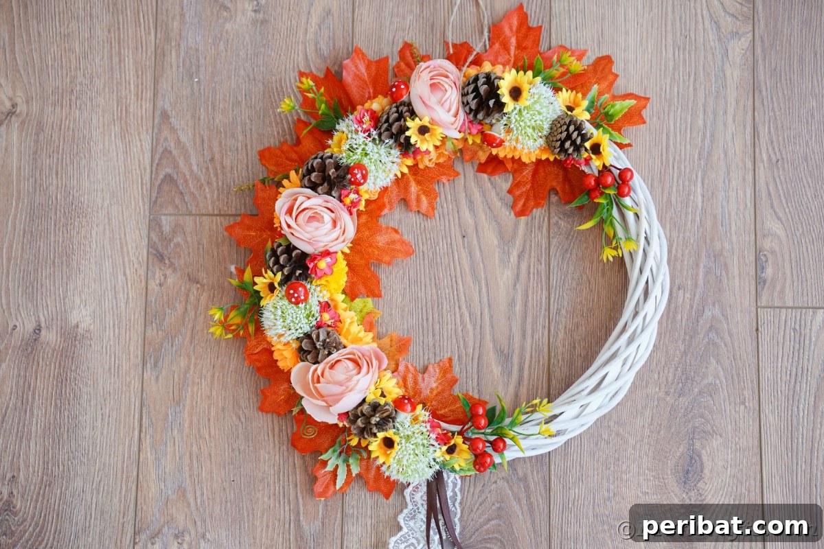 Charming Fall Blossom & Pinecone Wreath 3 Floral white wreath with lace on bottom laying on wood