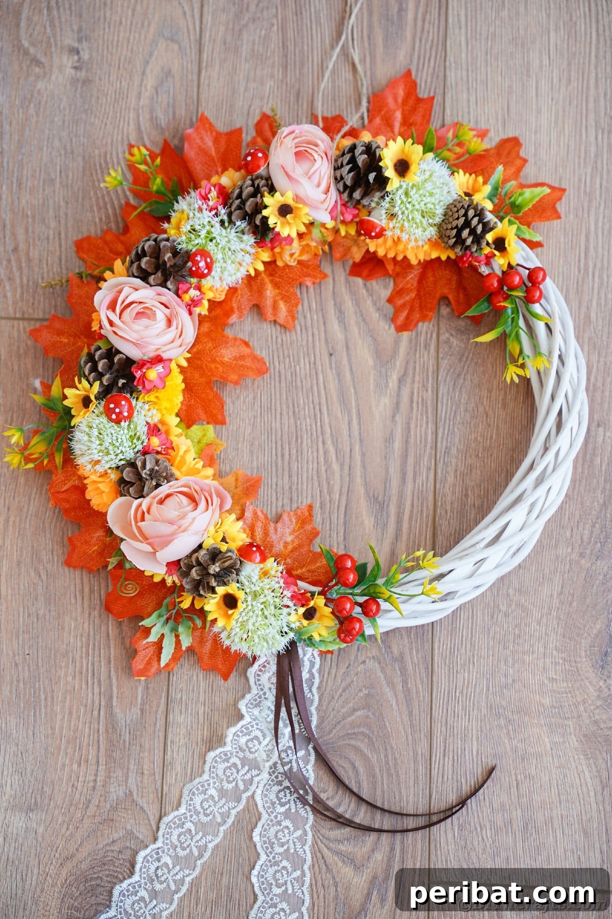 Charming Fall Blossom & Pinecone Wreath 16 Pinecone and fake leaf wreath on wood