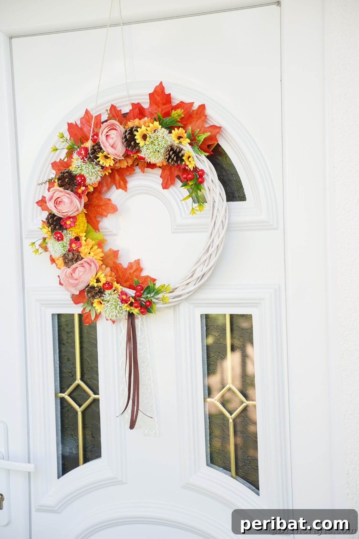 Charming Fall Blossom & Pinecone Wreath 17 Fall colored wreath on white and glass door