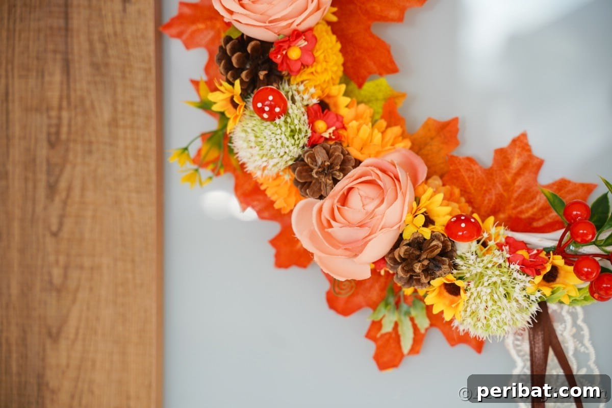 Charming Fall Blossom & Pinecone Wreath 5 Close up of flowers on wreath