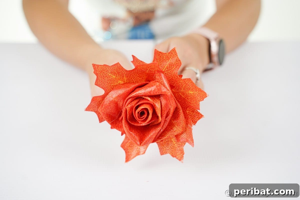 Elegant Autumn Rose Displays Crafted from Faux Foliage 18 Woman holding fake rose over white table