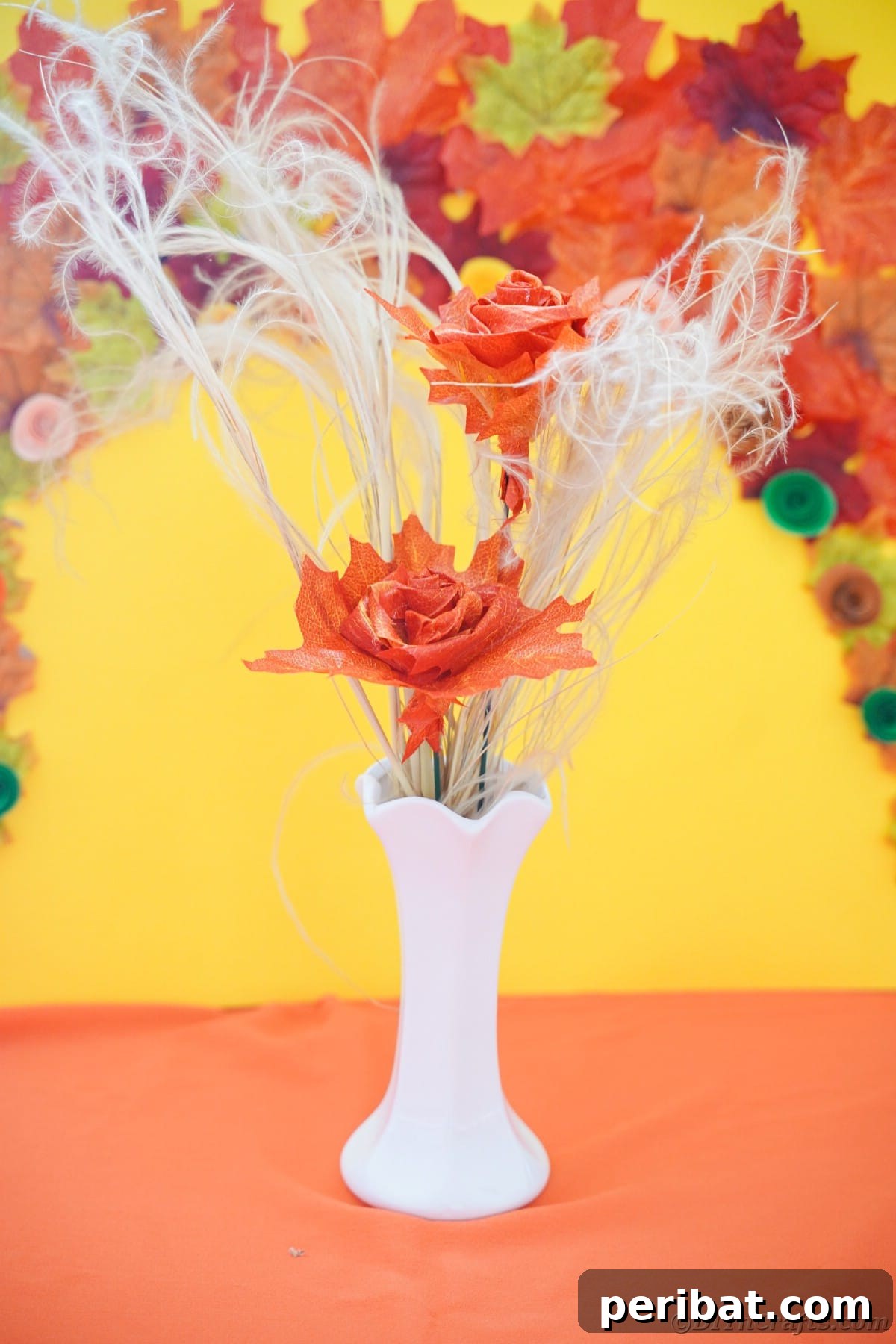 Elegant Autumn Rose Displays Crafted from Faux Foliage 3 Orange leaf rose and white branches in white vase