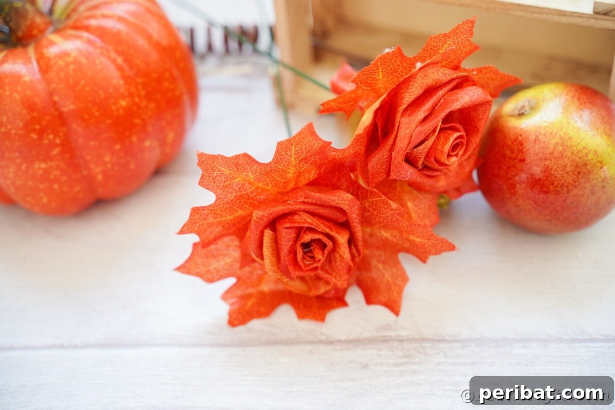 Elegant Autumn Rose Displays Crafted from Faux Foliage 4 Fake leaf roses on white table