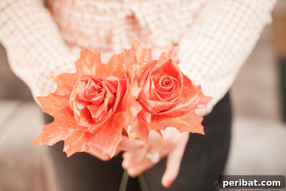 Elegant Autumn Rose Displays Crafted from Faux Foliage 6 Two fake roses in hands