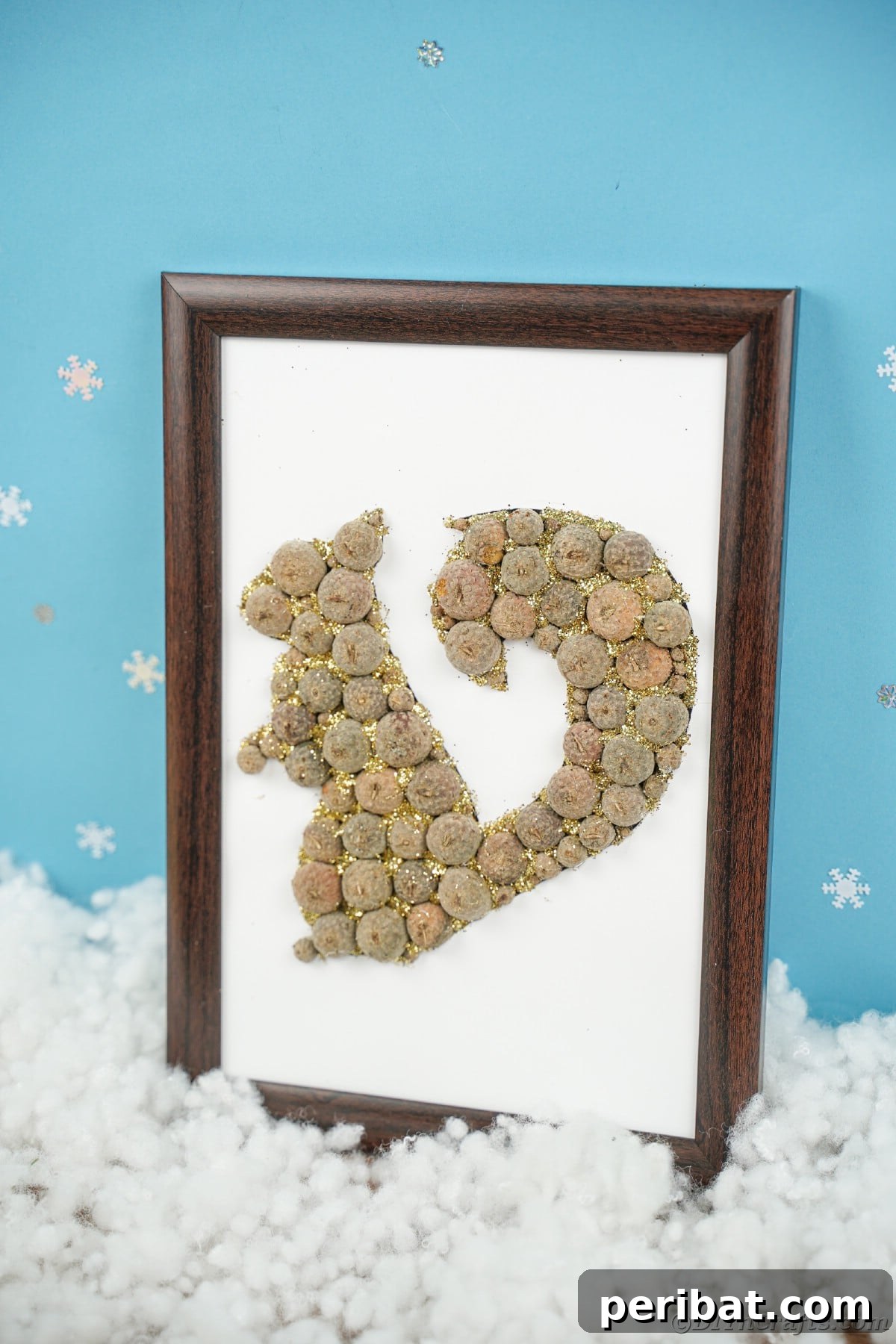 Charming Framed Squirrel with Acorn Cap Wall Decor 17 Squirrel picture on table with fake snow in front of blue wall