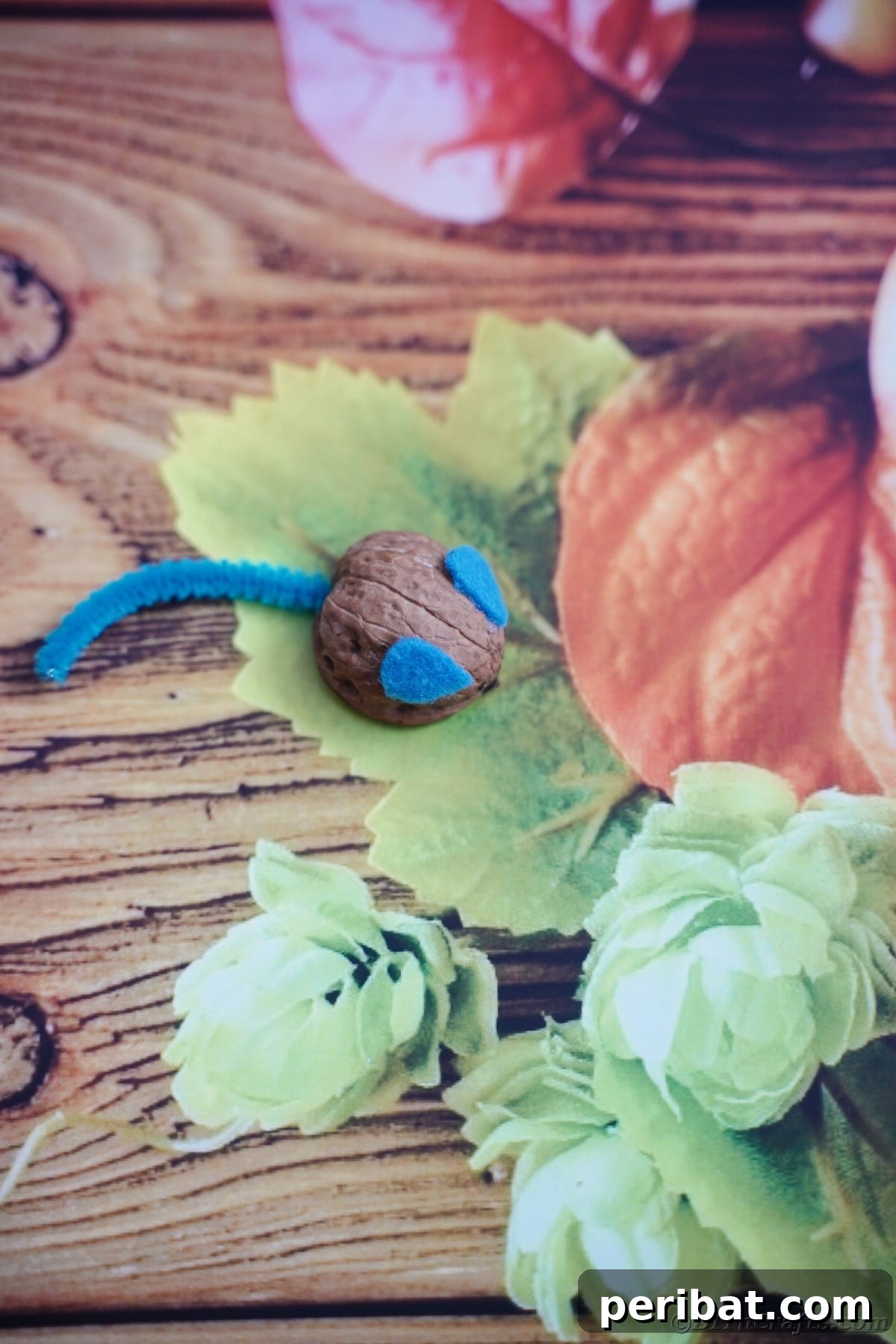 Walnut Wonders: Upcycled Shell Mouse Art 16 Walnut mouse on fall scrapbook paper