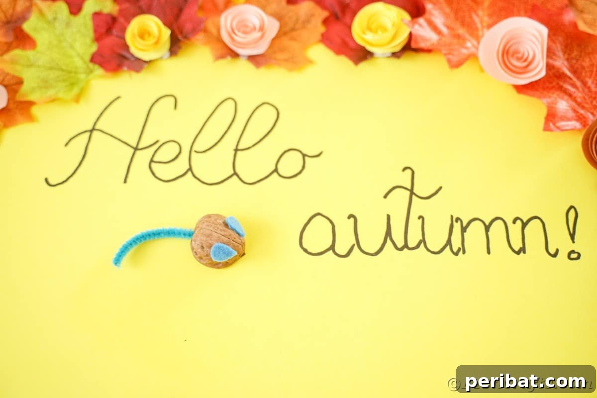 Walnut Wonders: Upcycled Shell Mouse Art 5 A 'Hello Autumn' sign positioned on yellow paper, with a walnut shell mouse perched above the message, capturing a warm, seasonal vibe.