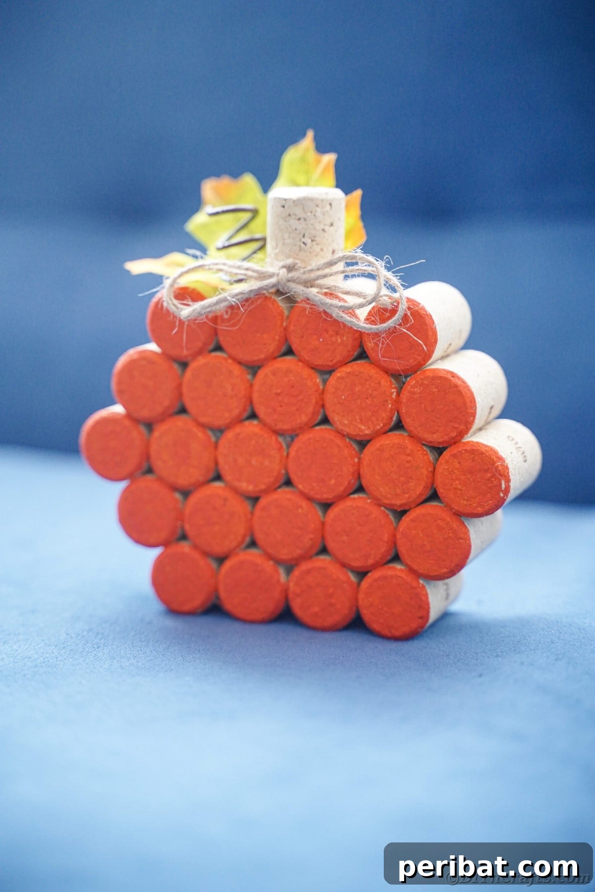 a charming wine cork pumpkin displayed on a table, highlighting its rustic and handmade appeal