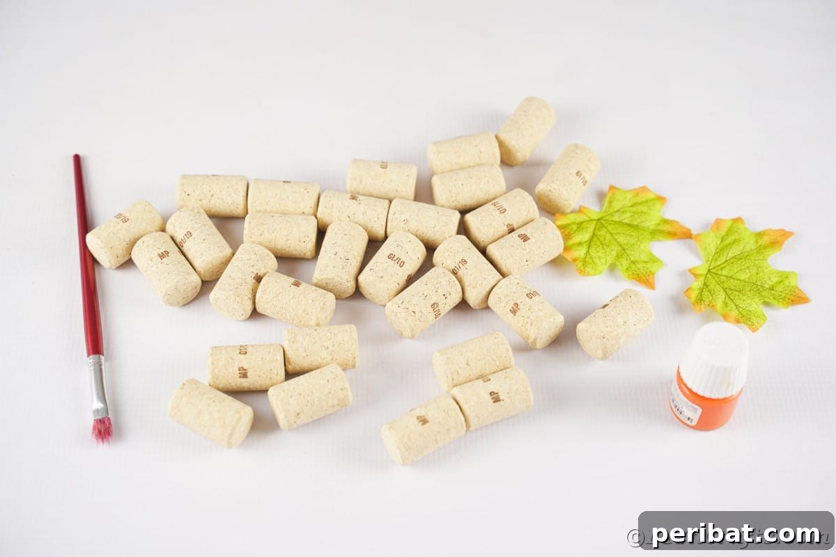 Charming Rustic Wine Cork Pumpkin Creation 8 a collection of wine corks, a paintbrush, and a pot of orange paint neatly arranged on a crafting table