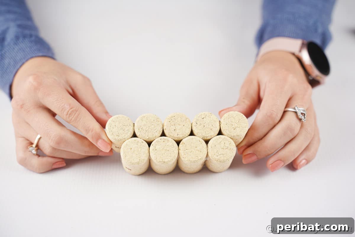 Charming Rustic Wine Cork Pumpkin Creation 10 two distinct stacks of wine corks, carefully glued together, illustrating the progression of a crafting project