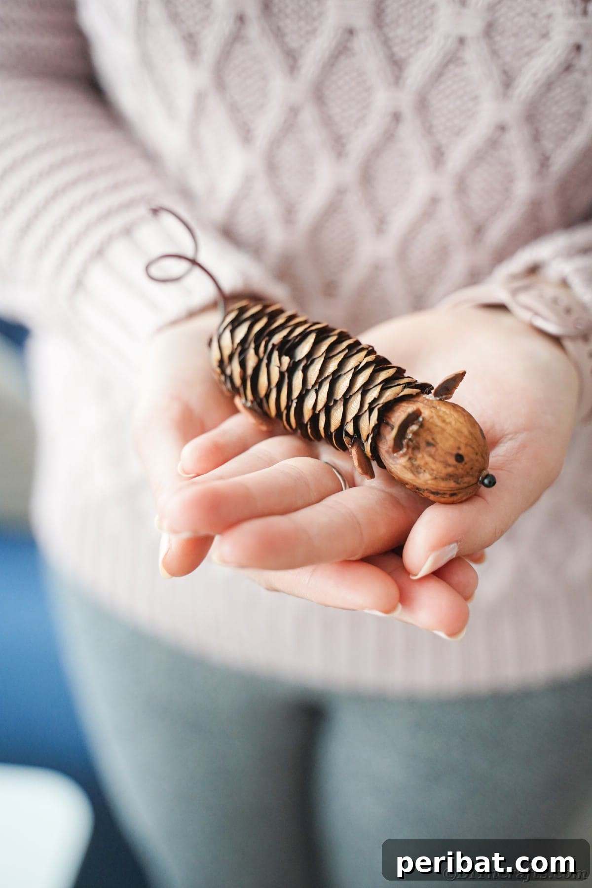 Adorable Pinecone and Pecan Mice Craft 2 lady in pink sweater holding pinecone mouse in hands
