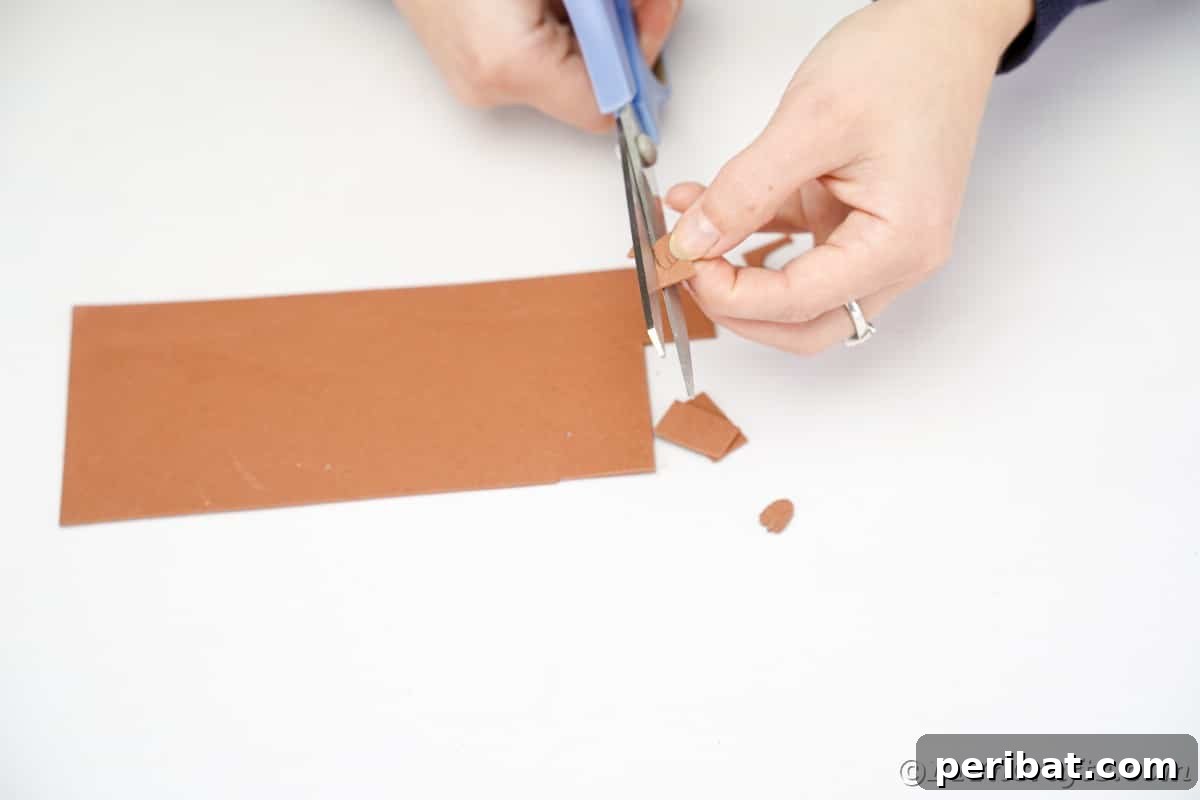 Adorable Pinecone and Pecan Mice Craft 13 hand cutting ears out of brown paper