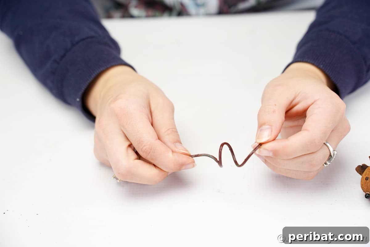 Adorable Pinecone and Pecan Mice Craft 19 hands holding brown spring