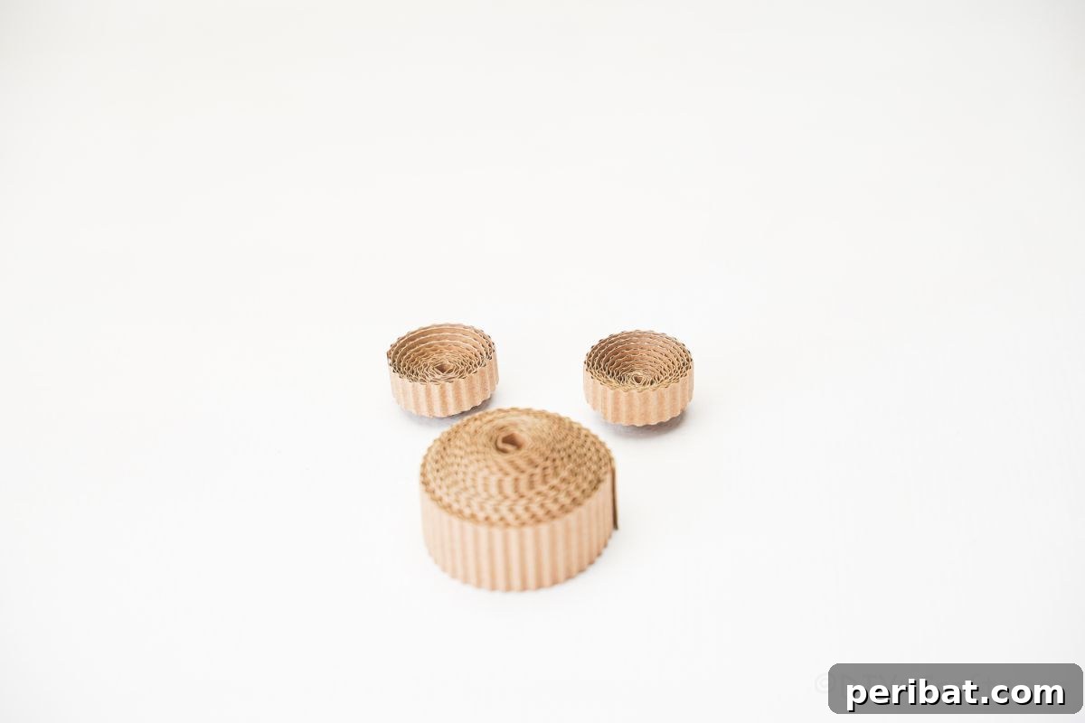 Rustic Rolled Cardboard Owl Art 15 three rolled cardboard circles on table