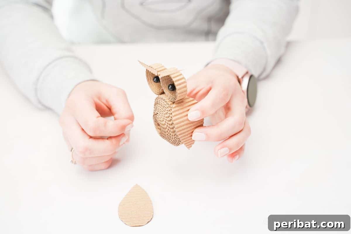 Rustic Rolled Cardboard Owl Art 19 gluing wing onto cardboard owl