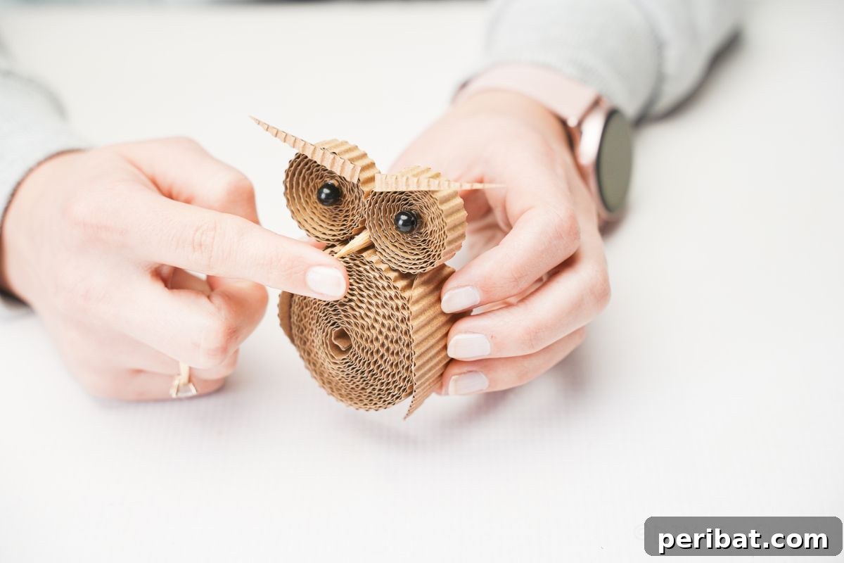 Rustic Rolled Cardboard Owl Art 20 hand gluing beak onto owl
