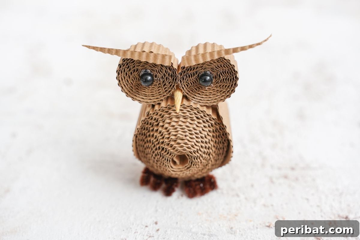 Rustic Rolled Cardboard Owl Art 5 paper owl against white background