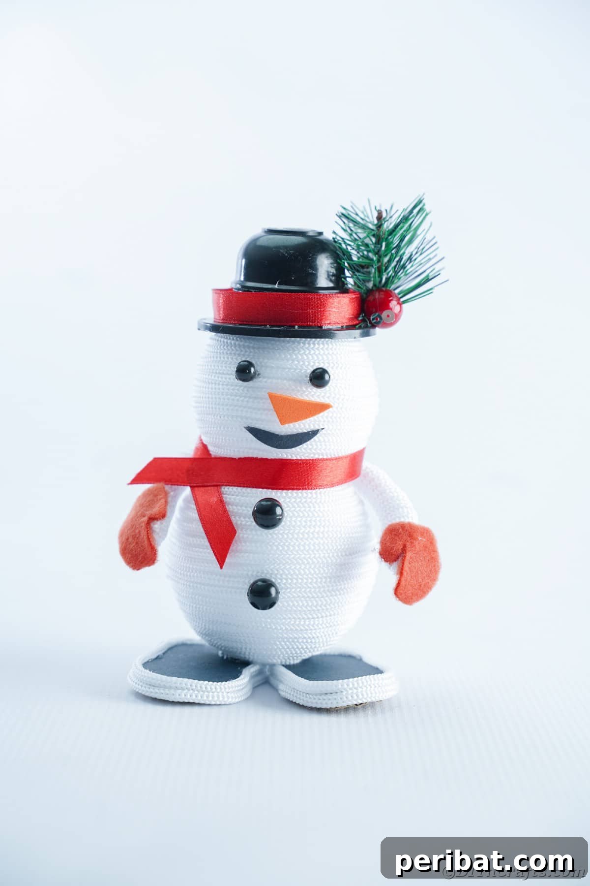 Cozy Twine Snowman Christmas Charm 26 rope snowman on white table
