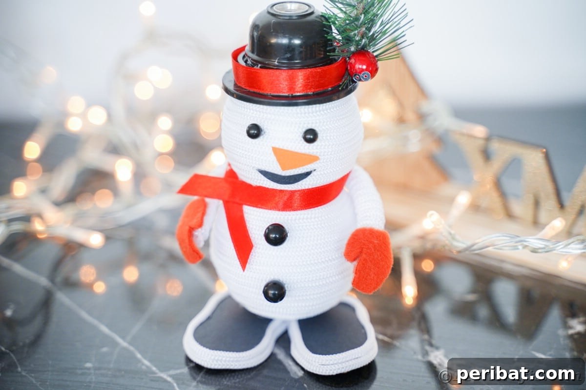 Cozy Twine Snowman Christmas Charm 5 black table with twinkle lights and mini snowman decoration