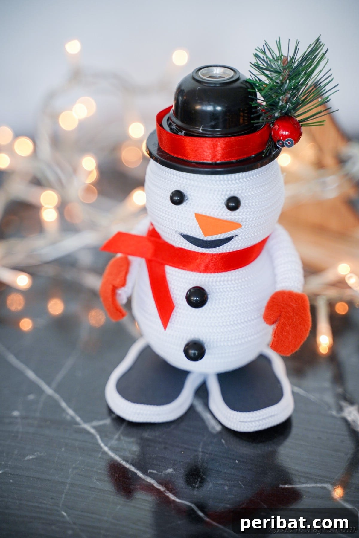 Cozy Twine Snowman Christmas Charm 28 snowman decor on black table by twinkle lights