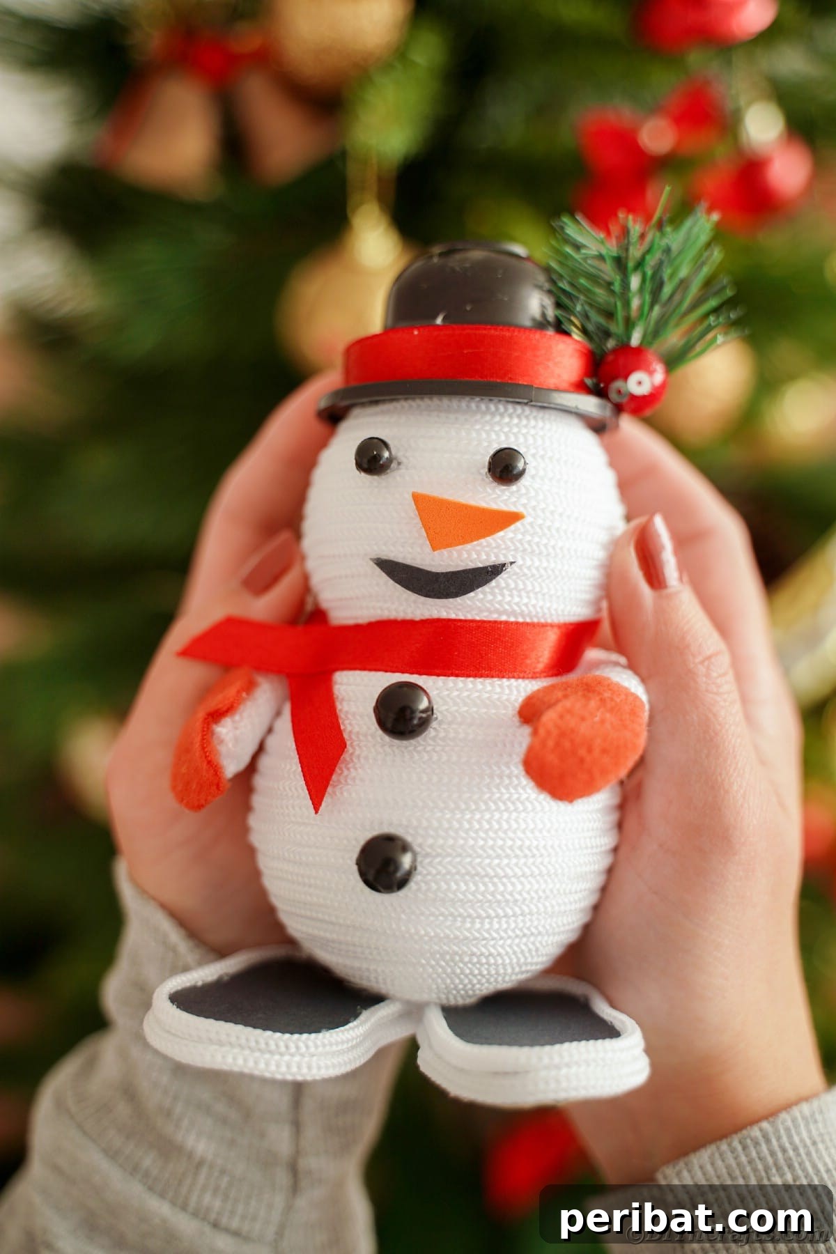 Cozy Twine Snowman Christmas Charm 6 mini snowman decoration held in hands