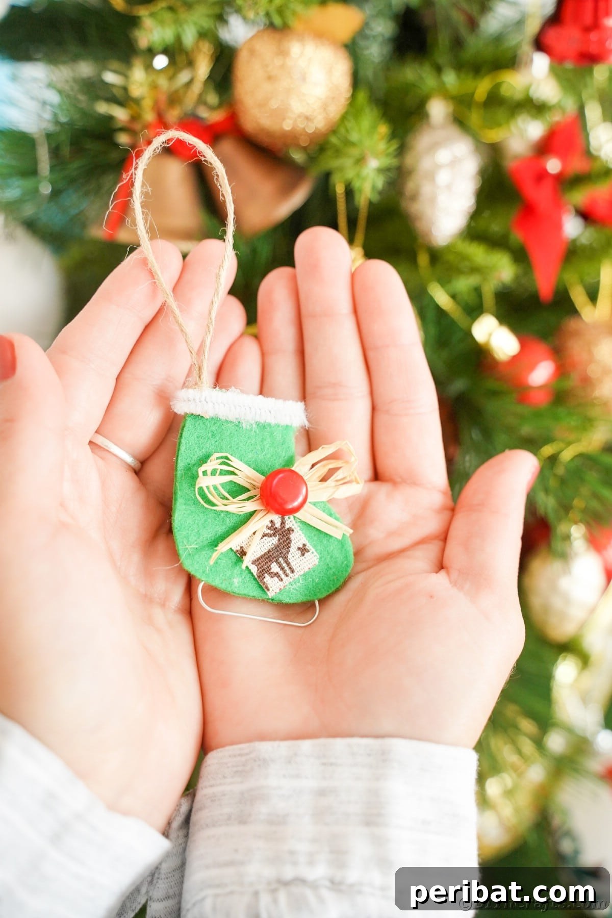 hands holding felt ice skate ornament
