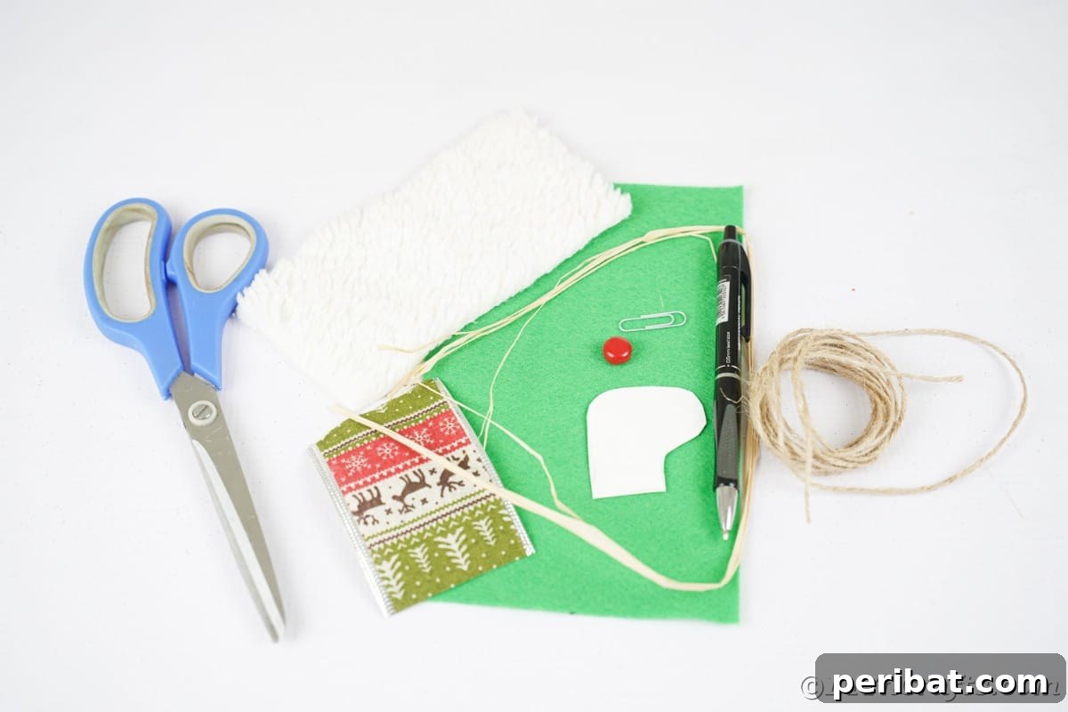 green felt ribbon and scissors on white table