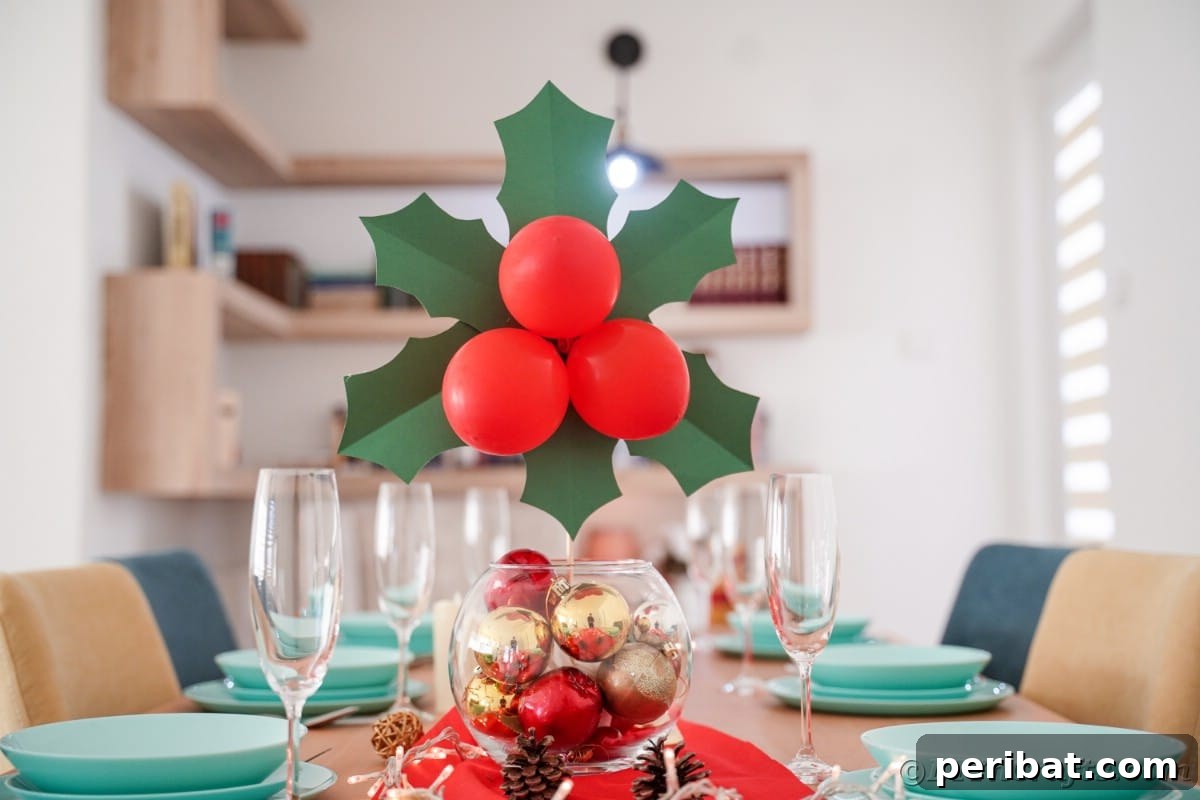 Oversized Holly Berry and Leaf Festive Decor 17 berry and leaves decoration in glass bowl on holiday table