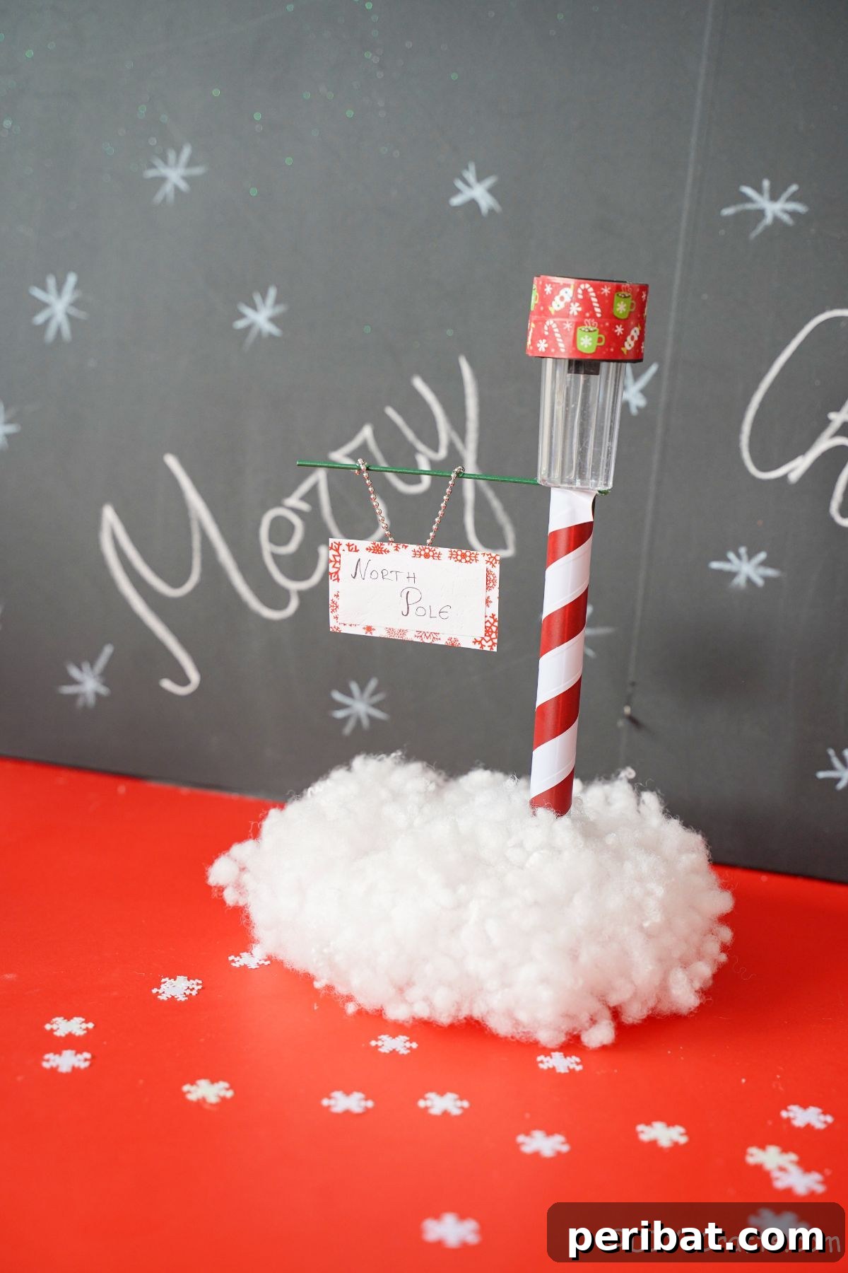 Whimsical Arctic Lamppost Craft 20 north pole street sign on red table with chalkboard in background