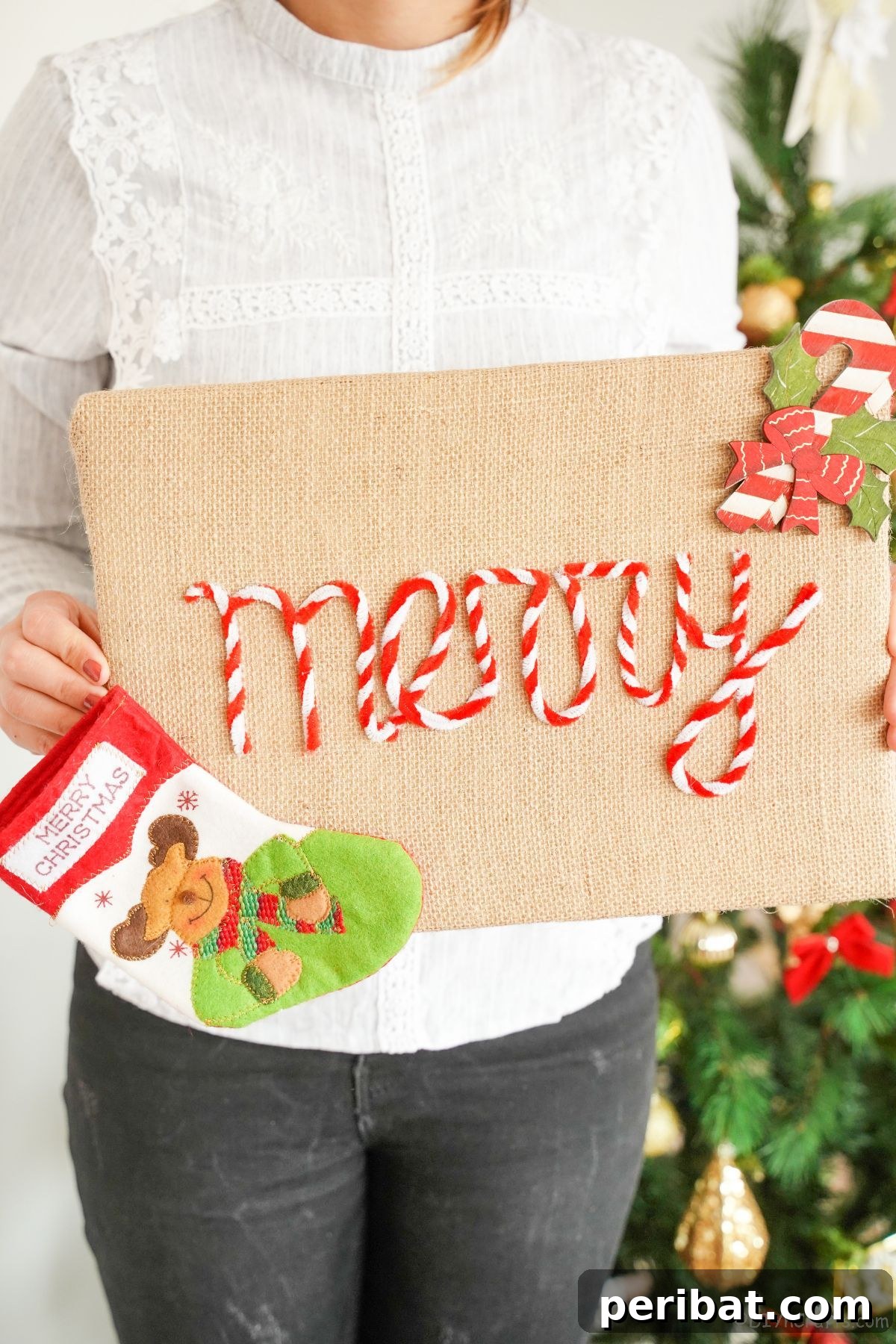 Farmhouse Burlap Christmas Decor 2 person in black pants holding merry burlap sign