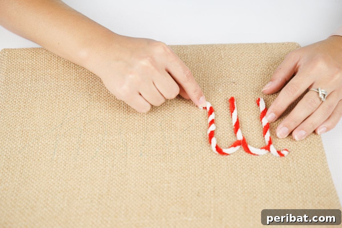 Farmhouse Burlap Christmas Decor 8 hand gluing pipe cleaners onto the burlap