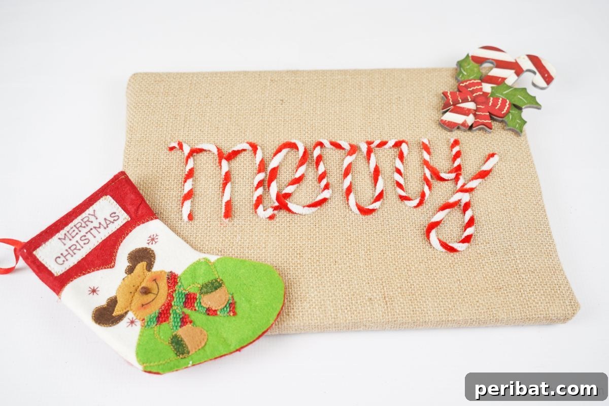 Farmhouse Burlap Christmas Decor 9 burlap sign that says merry and has mini stocking on white table