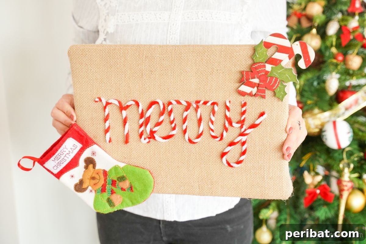 Farmhouse Burlap Christmas Decor 10 burlap Christmas sign held by person in white sweater