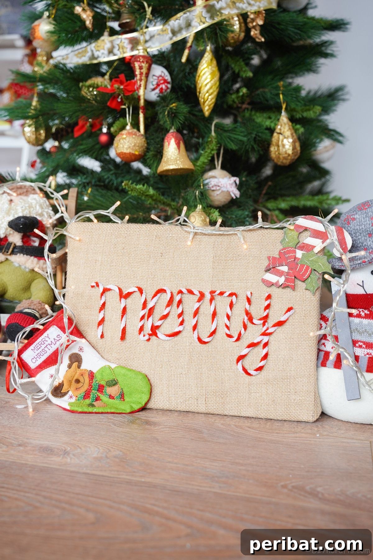 Farmhouse Burlap Christmas Decor 14 burlap sign with the word Merry in front of christmas tree