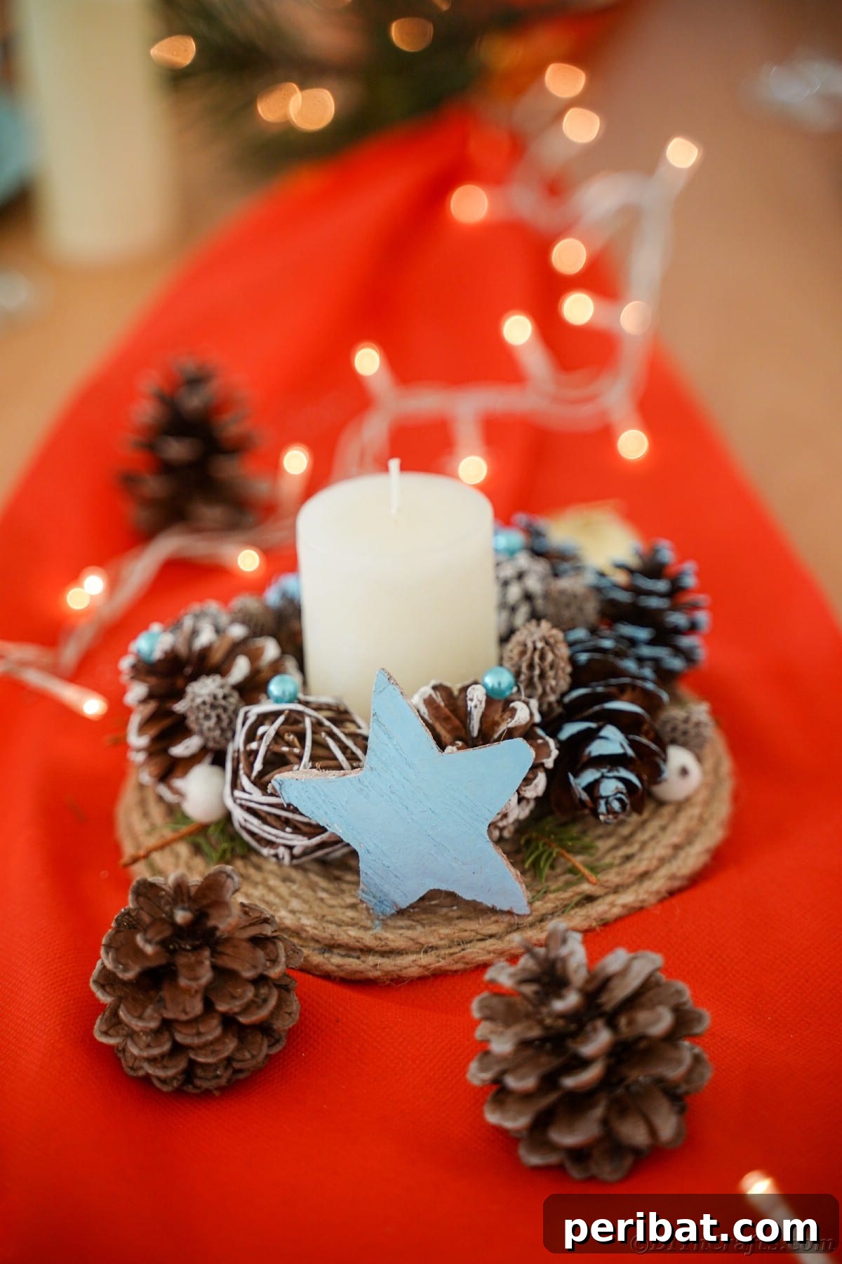 Cozy Farmhouse Christmas Candle Centerpiece 4 pinecone and star candle holder on red fabric