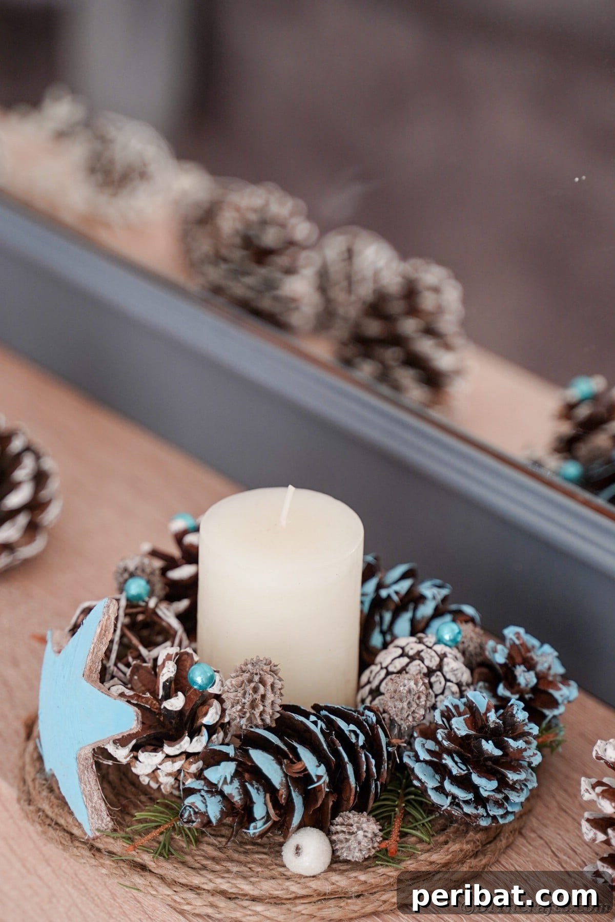 Cozy Farmhouse Christmas Candle Centerpiece 17 pinecone and greenery candle holder in front of gray mirror