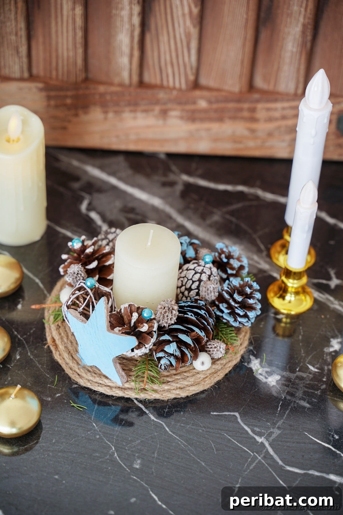 Cozy Farmhouse Christmas Candle Centerpiece 7 taper candle in gold holder next to pinecone candle holder