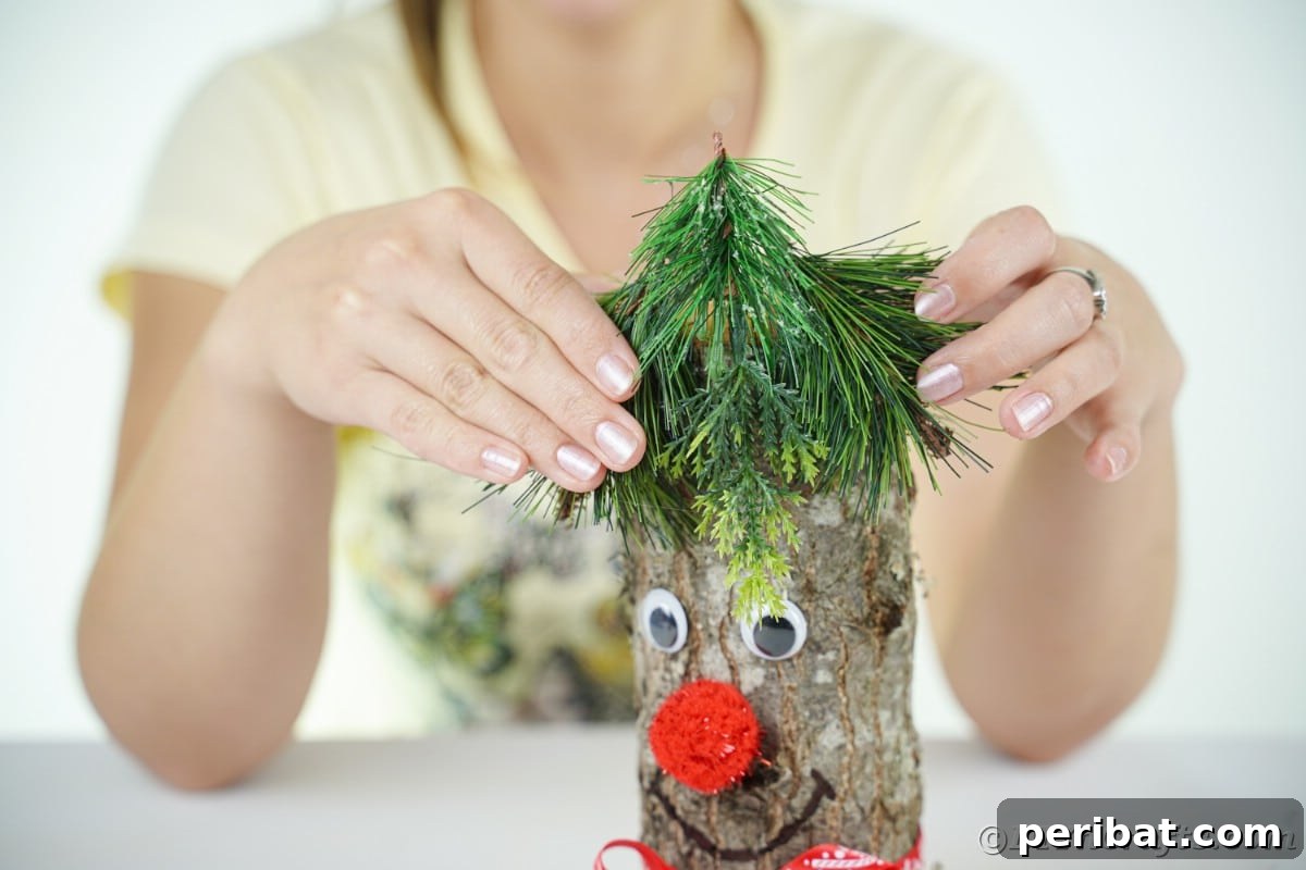 Whimsical Woodland Log Reindeer Decor 13 lady in yellow holding greenery on top of log with face
