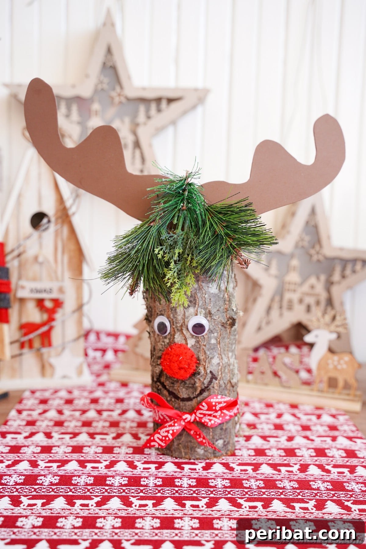 Whimsical Woodland Log Reindeer Decor 17 reindeer made of log and paper on table by holiday decor