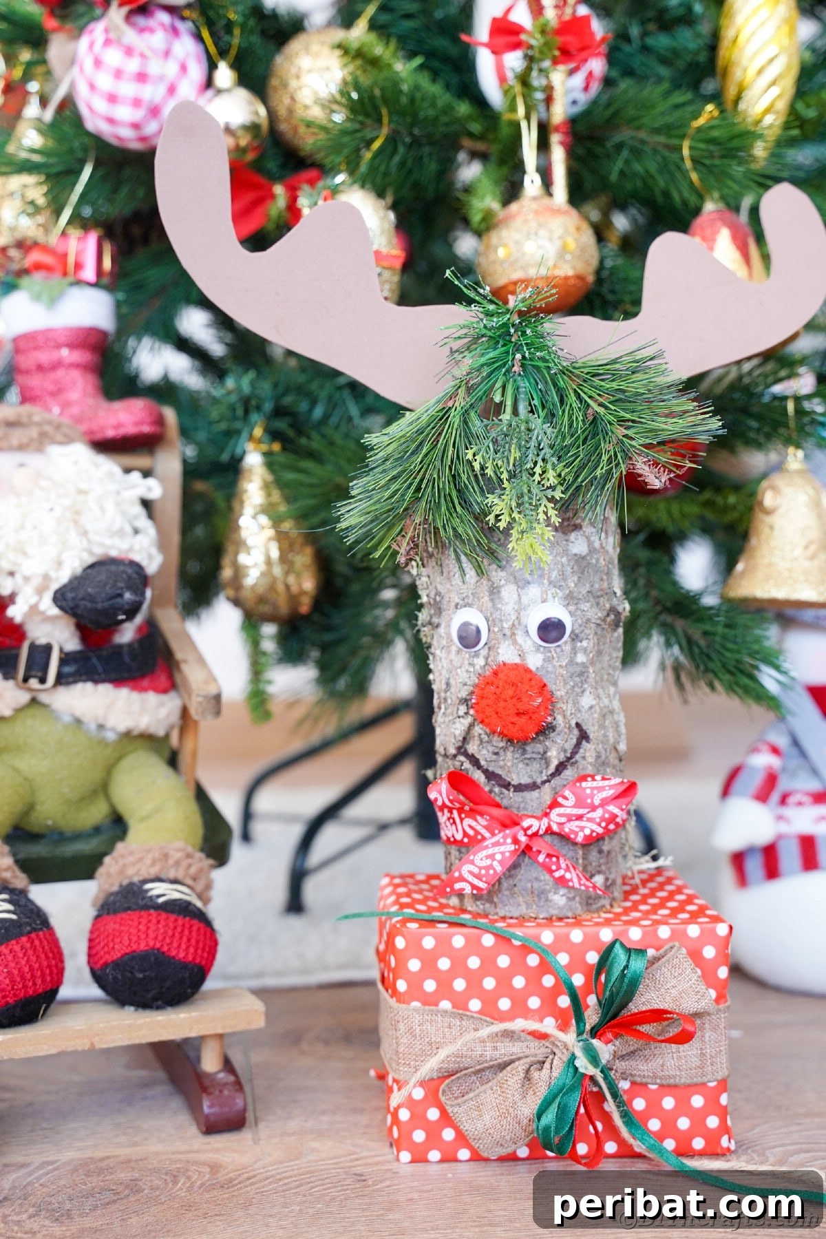 Whimsical Woodland Log Reindeer Decor 6 log reindeer in front of Christmas tree