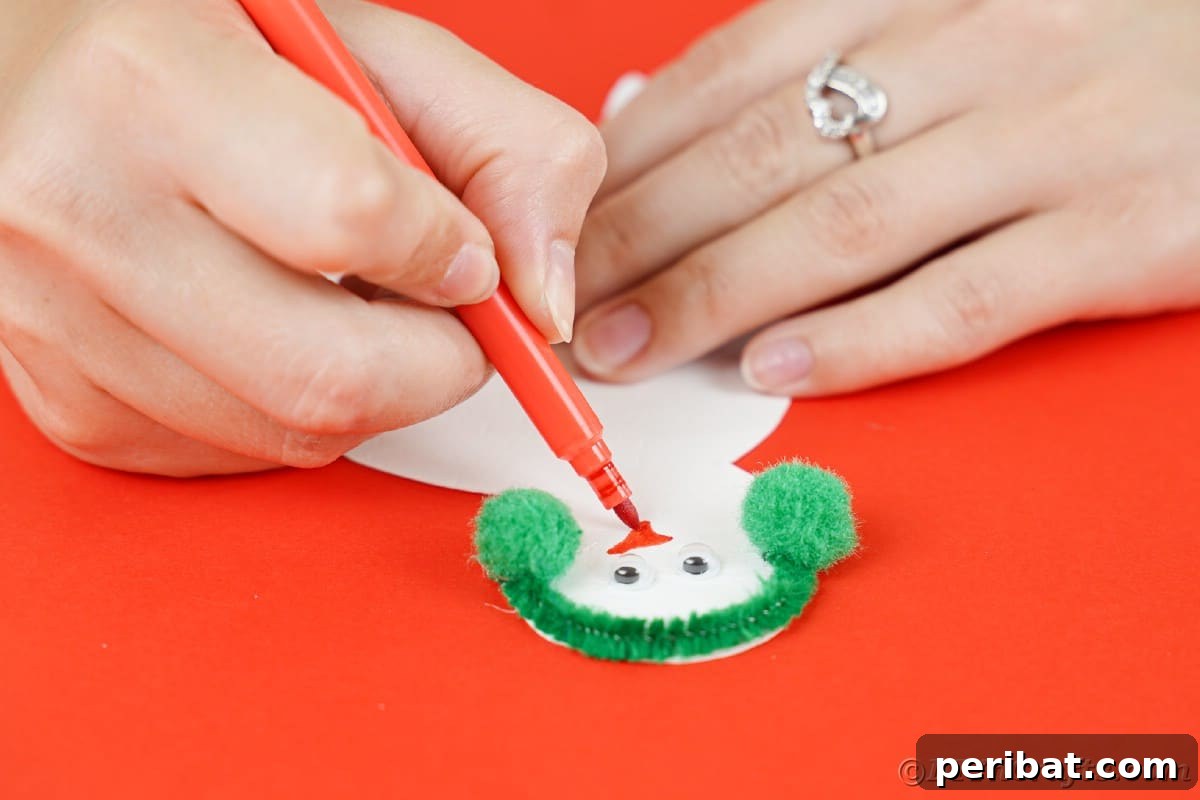 Simple Snowman Christmas Card Craft for Children 14 hand drawing nose onto paper snowman