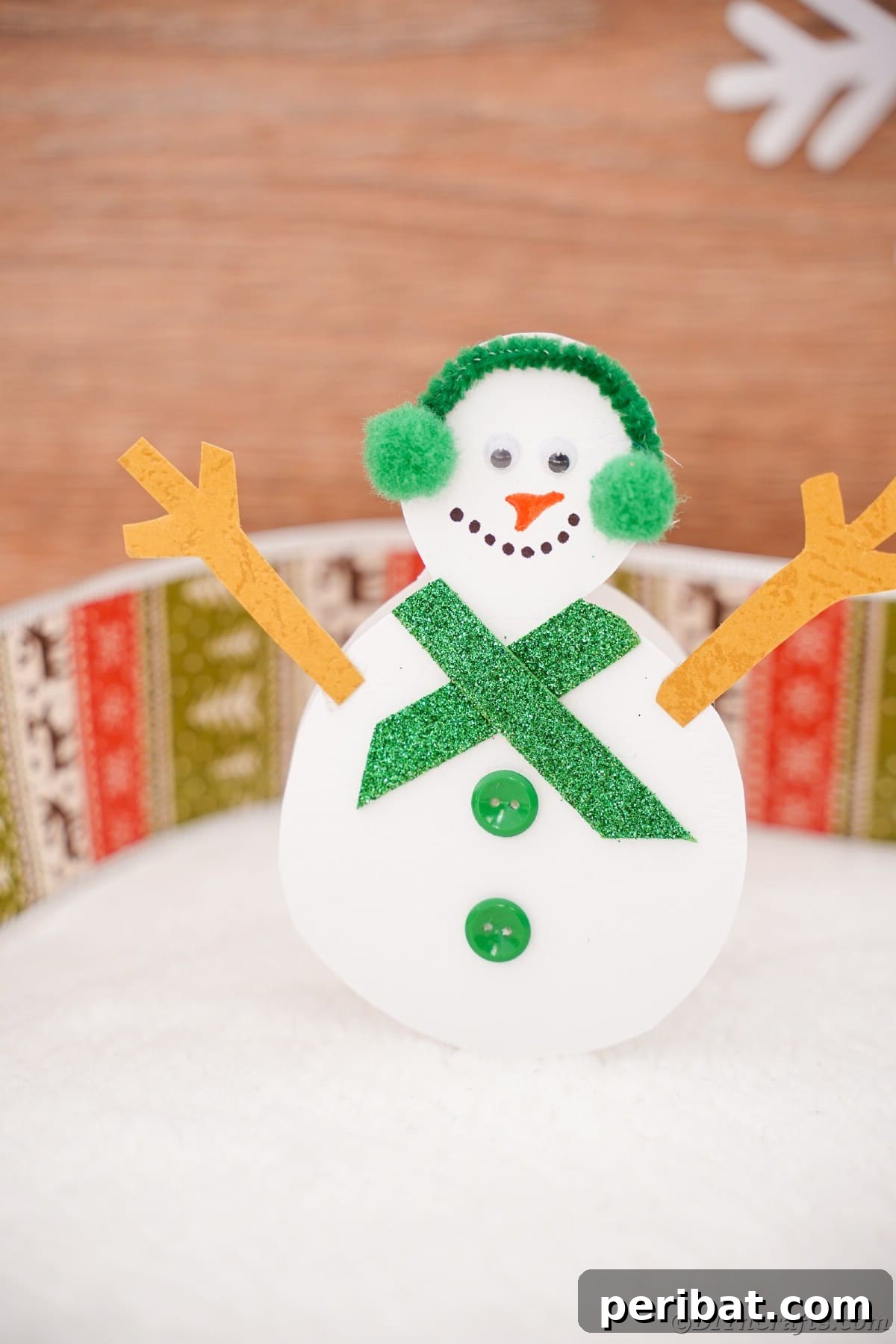 Simple Snowman Christmas Card Craft for Children 20 paper snowman on top of white table