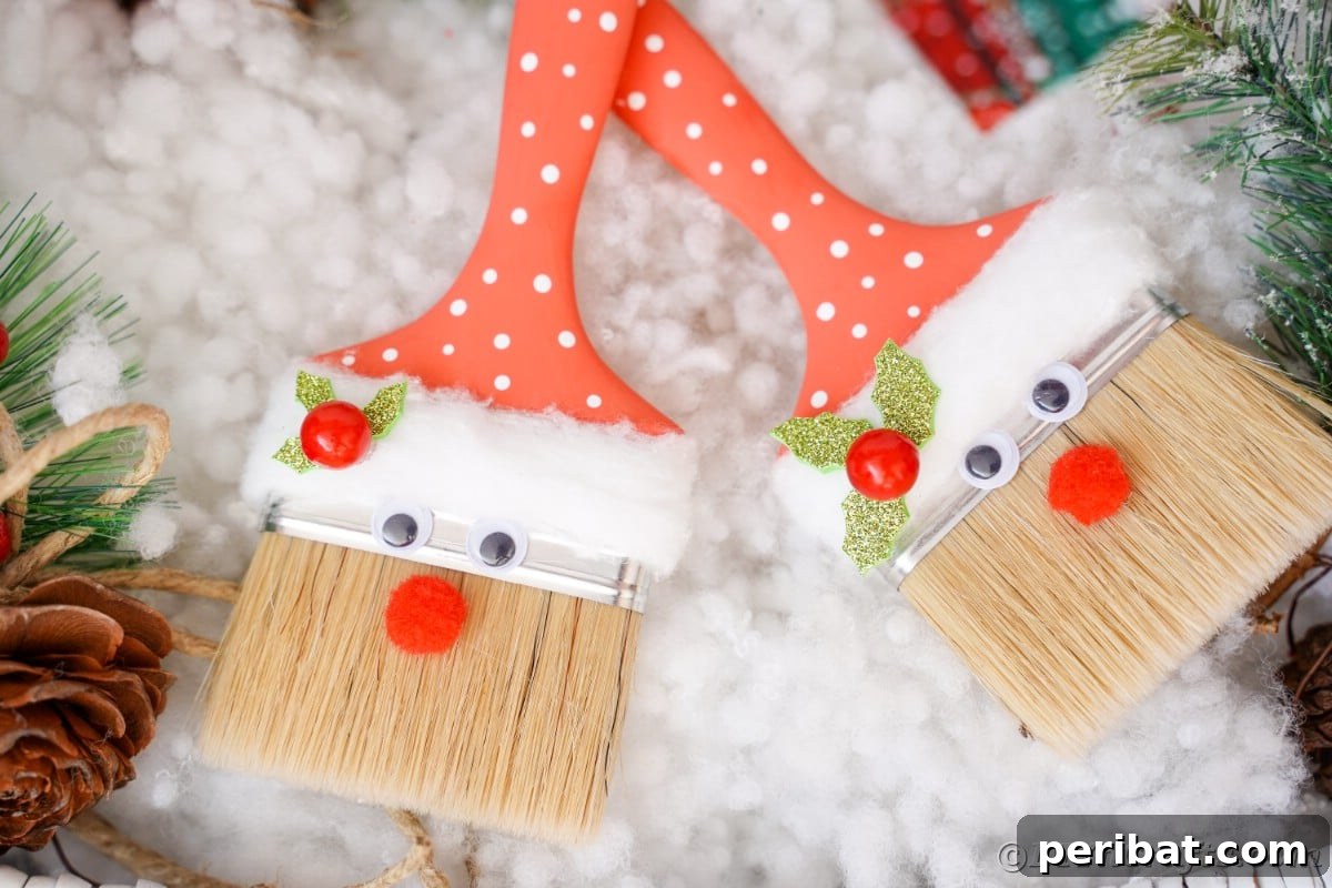 Multiple charming Santa Claus paintbrushes arranged on faux snow, creating a whimsical and festive holiday display.