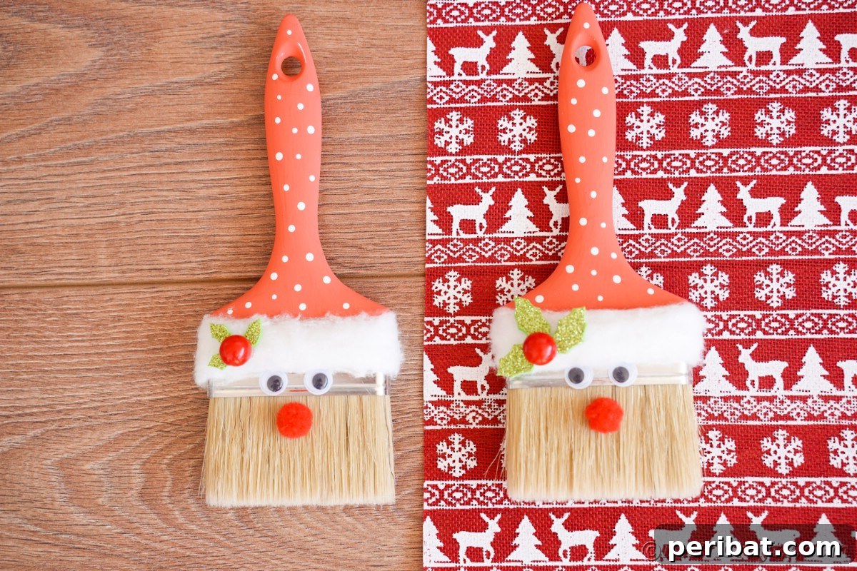 A paintbrush Santa Claus decoration gracefully resting on a table, accompanied by festive holiday wrapping paper, ready for the season.
